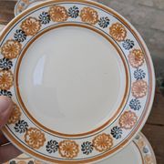 10 dessert plates Saint Amand Amandinoise frilled with orange and black flowers.