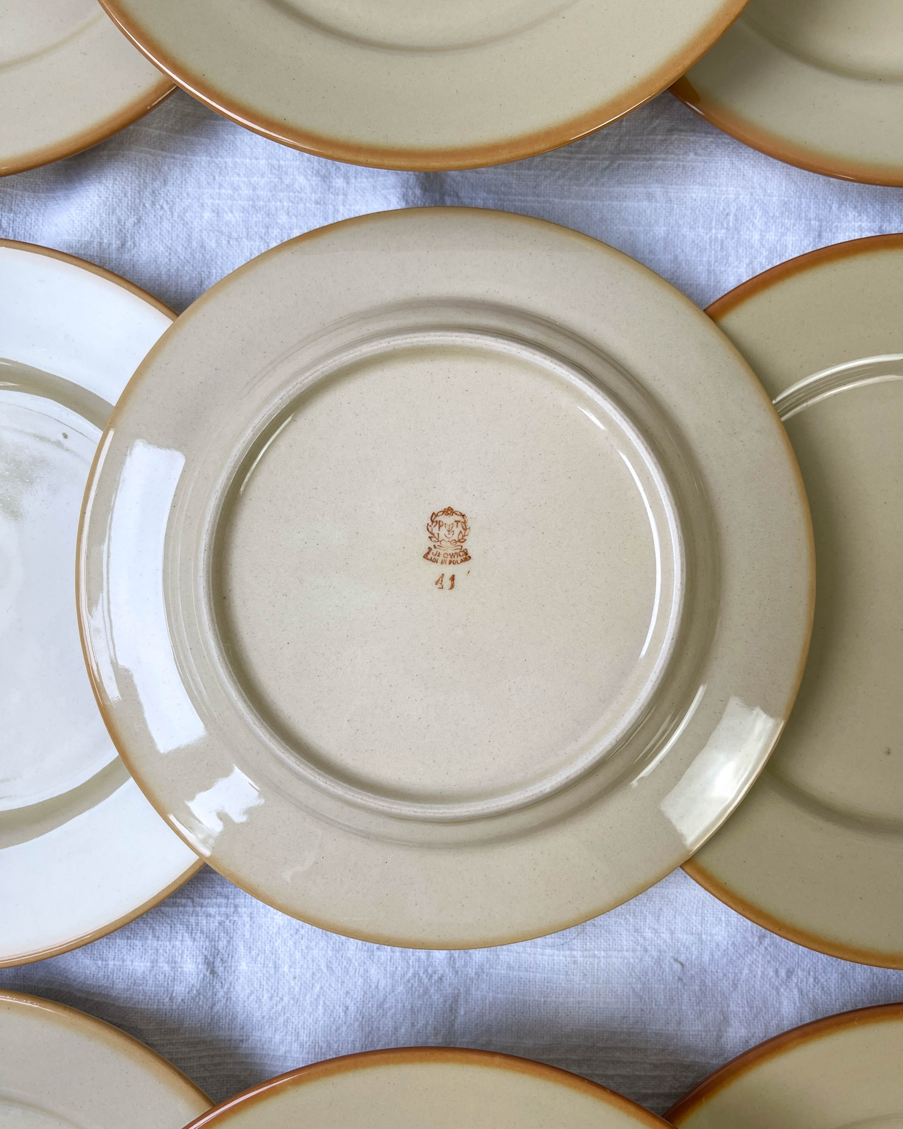 9 mid-century beige Tulowice stoneware plates