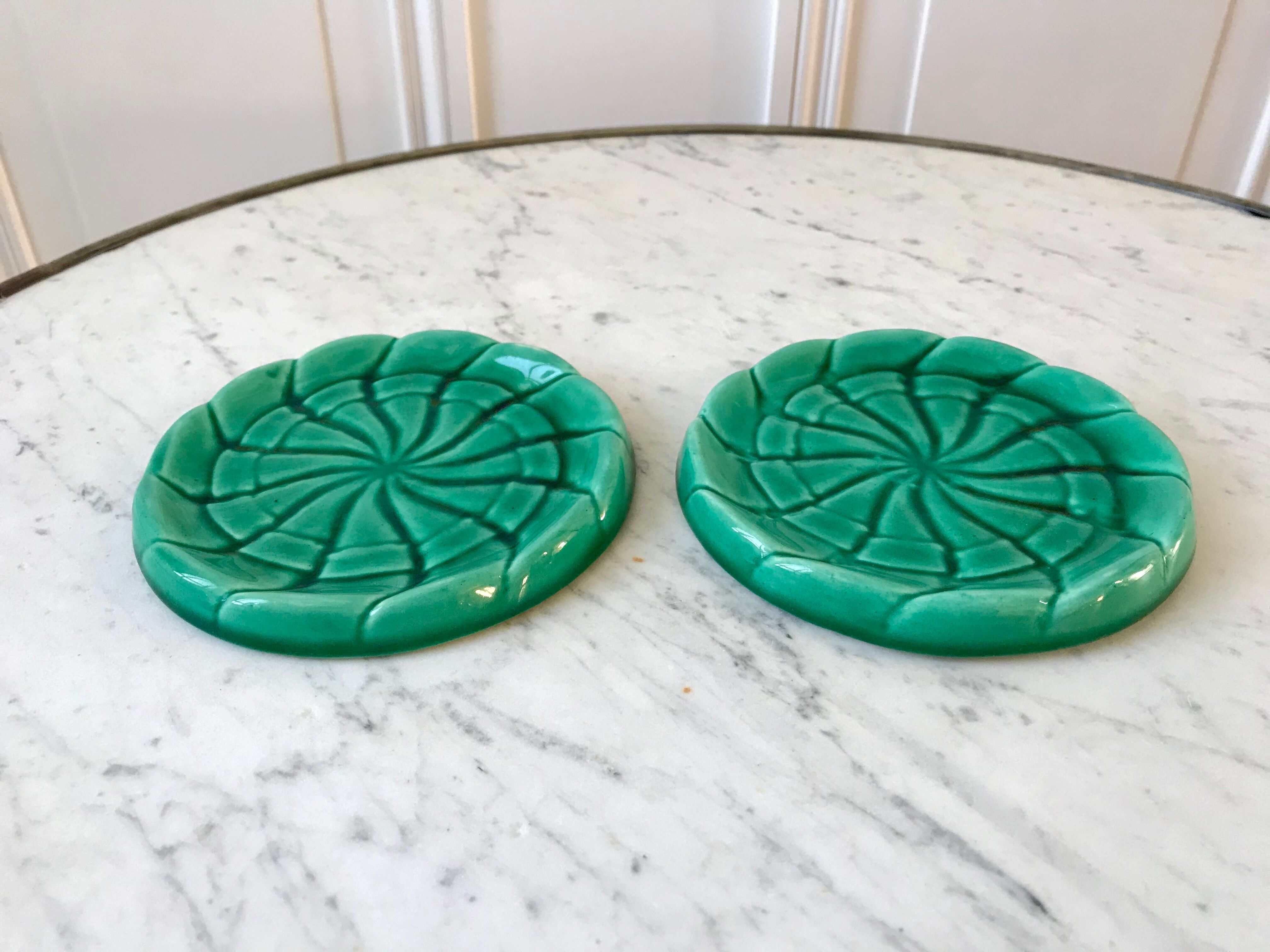 Duo of green slip bottle coasters signed marjac bauzil 50s