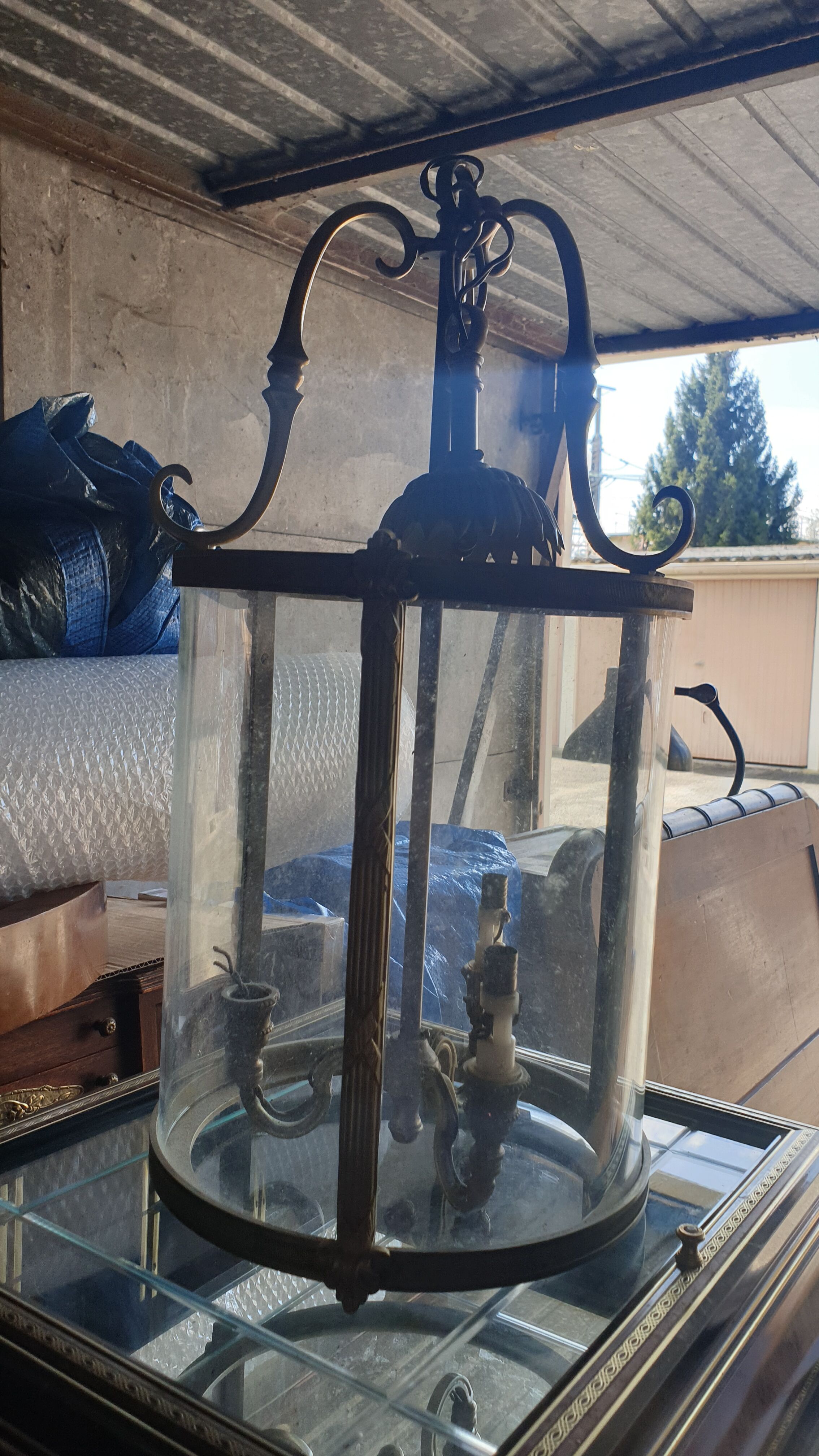 Suspension in glass and brass