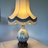 19th-century blue grand feu faience lamp, tripod bronze, fringed lampshade.