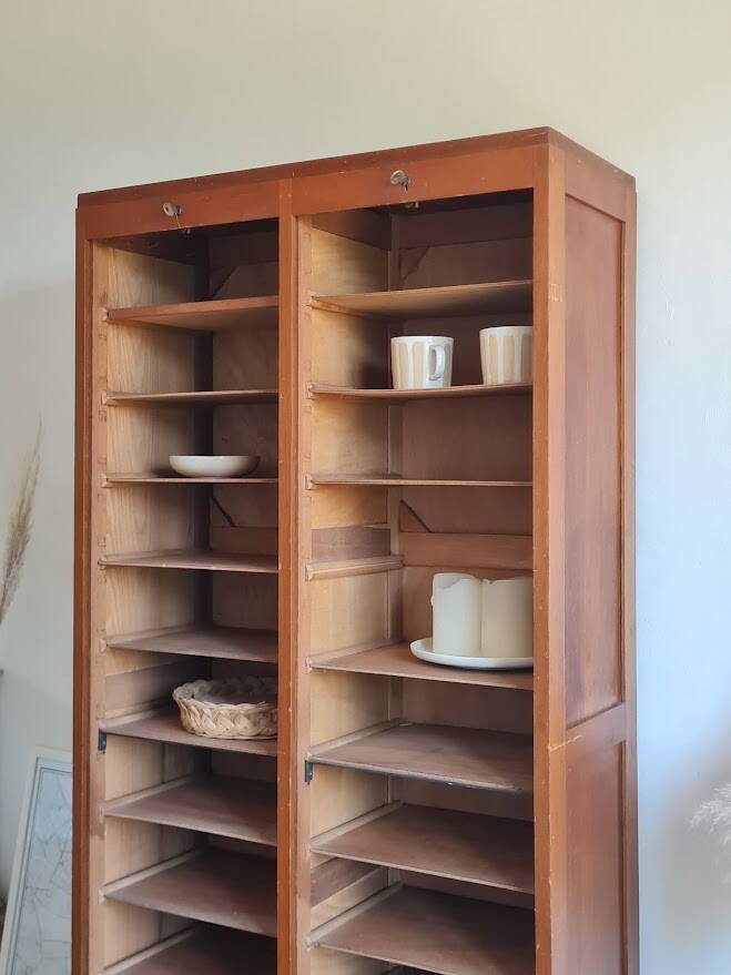 Vintage double curtain filing cabinet.