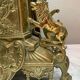 Fireplace trim clock and adornment of antique bronze candelabra