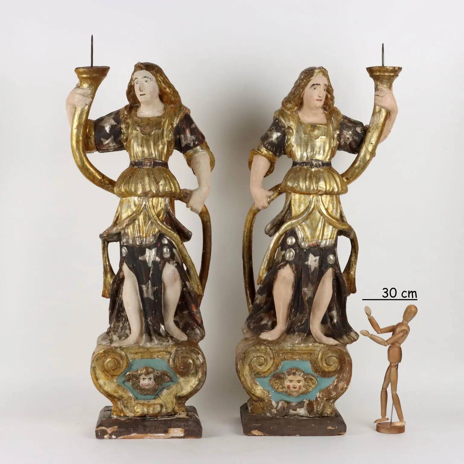 Antique wooden lacquered angel-shaped candlesticks, 18th century.