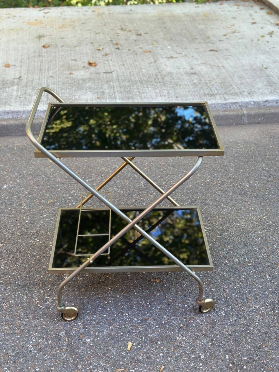 Mid-Century 1978 brass and black smoked glass wheeled dessert trolley.