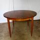 Round rosewood table with extension from the 70s