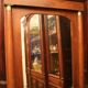 Mahogany pediment and half-column mirror and 118x91cm Empire-style bronze ornament