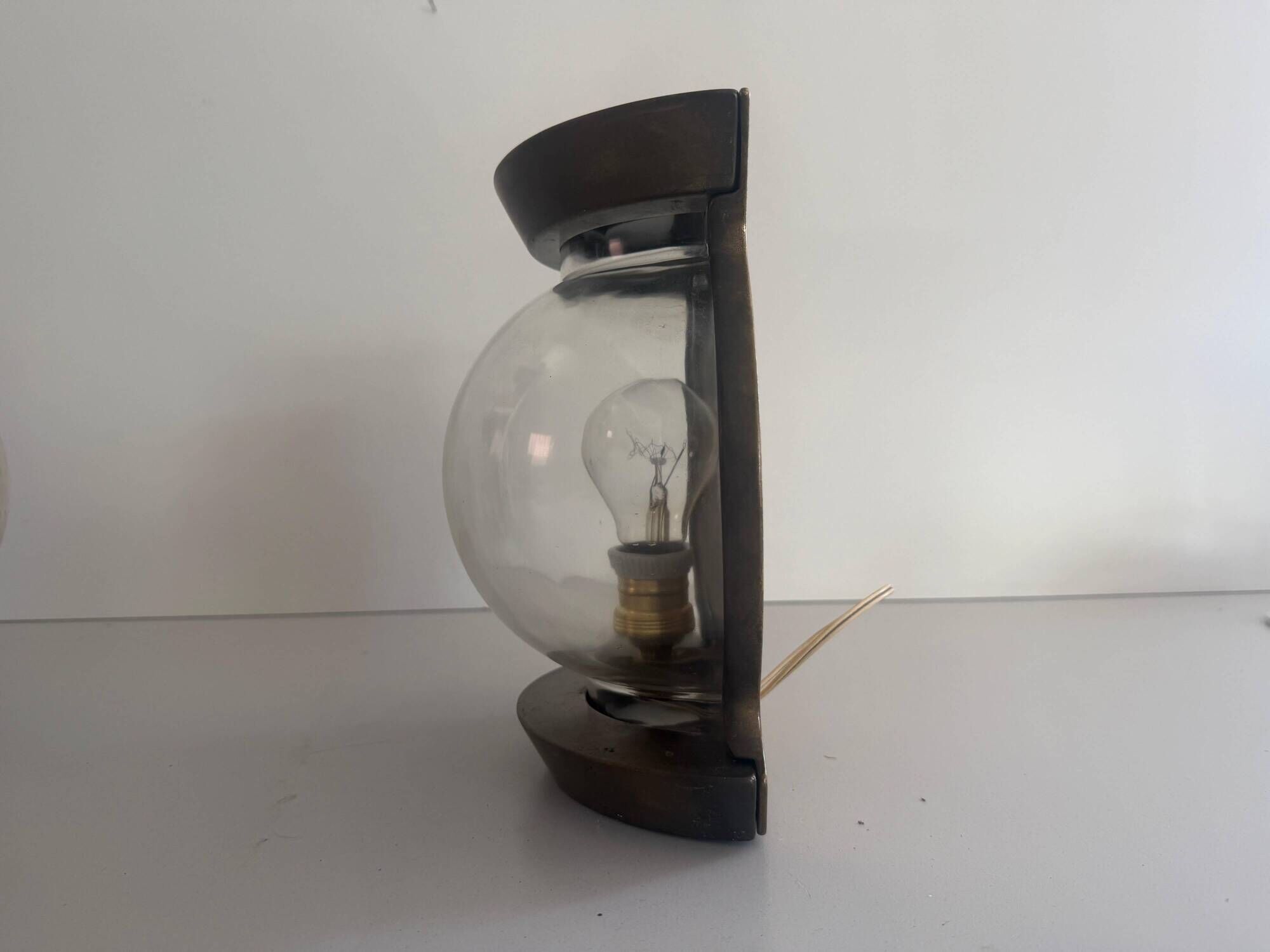 Pair of bronze and glass wall lights from the mid-century, 1960, Italy.
