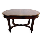 Oval wooden table with extensions