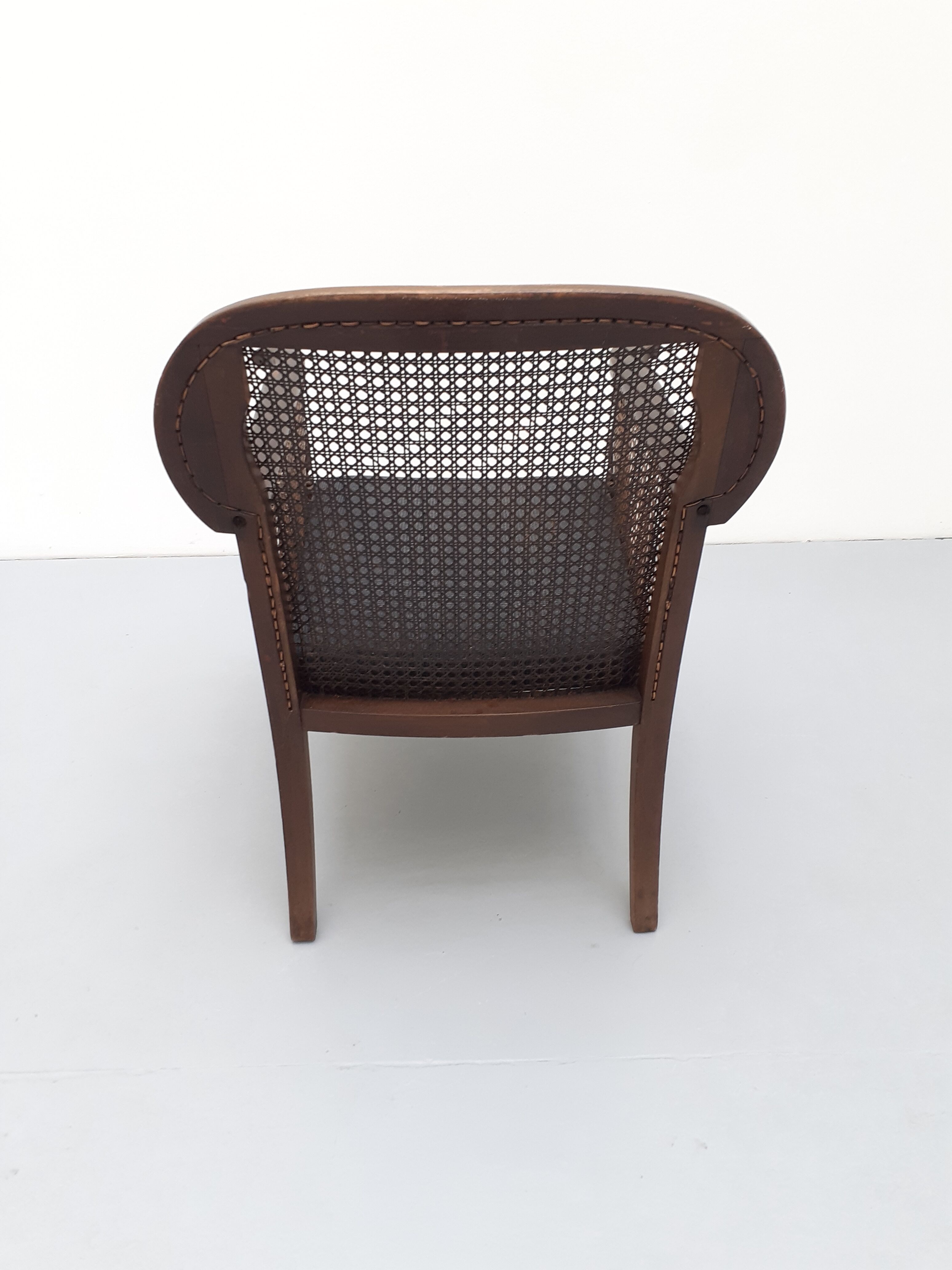 Colonial wooden armchair and cannage