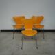 3 yellow Series 7 chairs by Arne Jacobsen, produced by Fritz Hansen, 1980s.