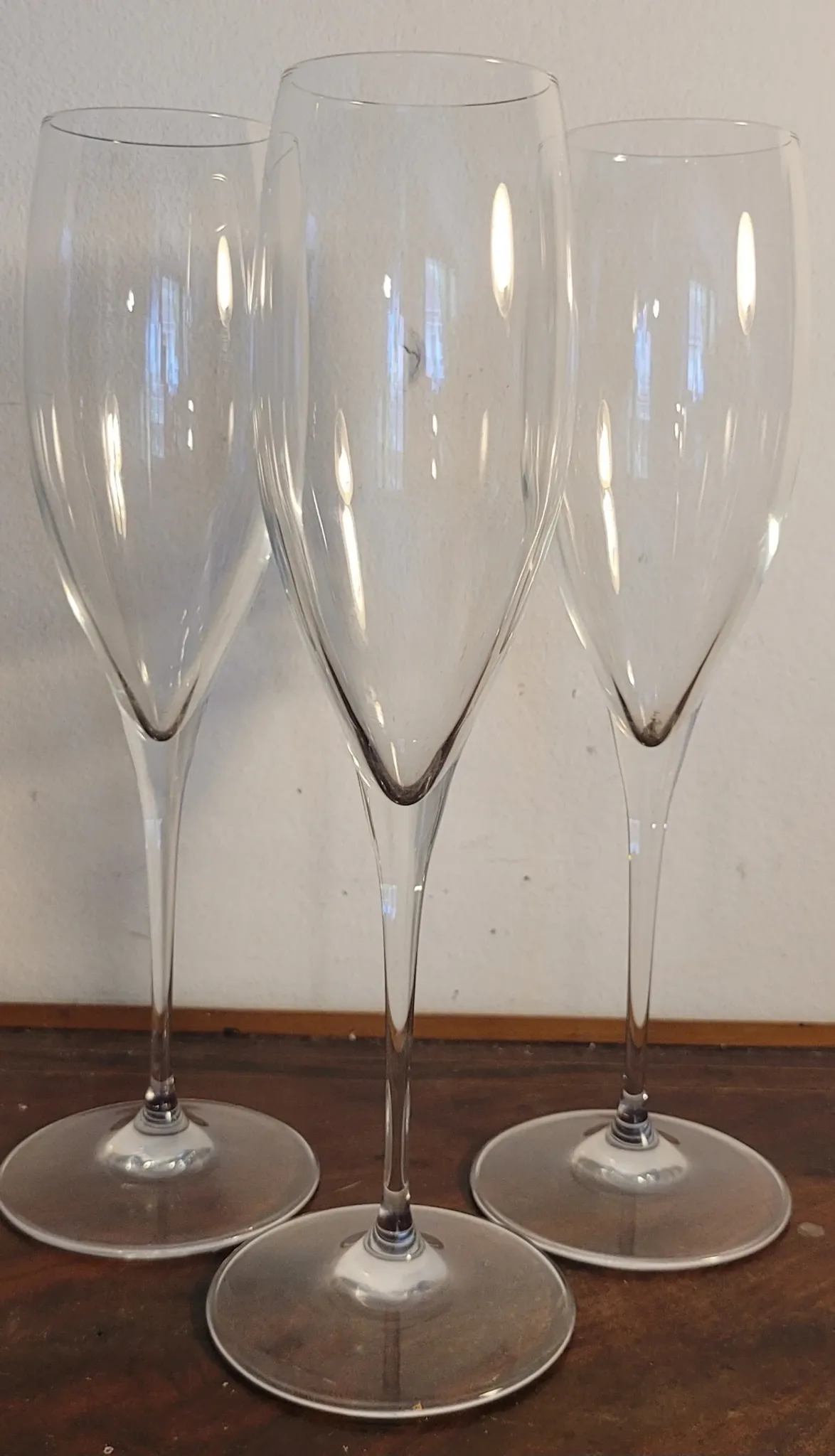 3 large crystal champagne flutes. No brand.