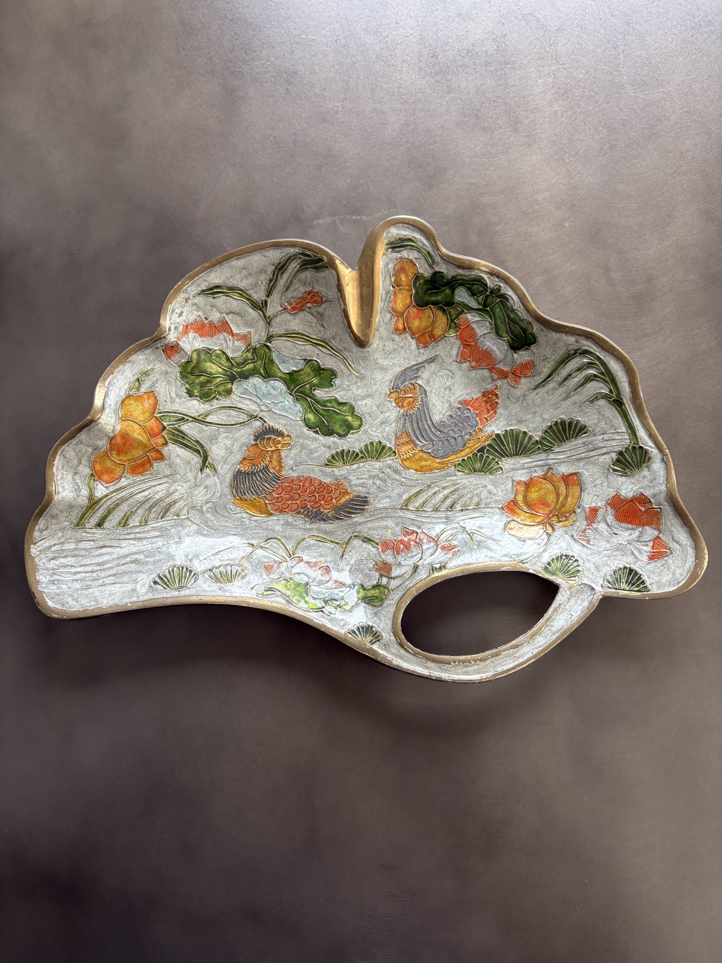 Old brass pocket emptier