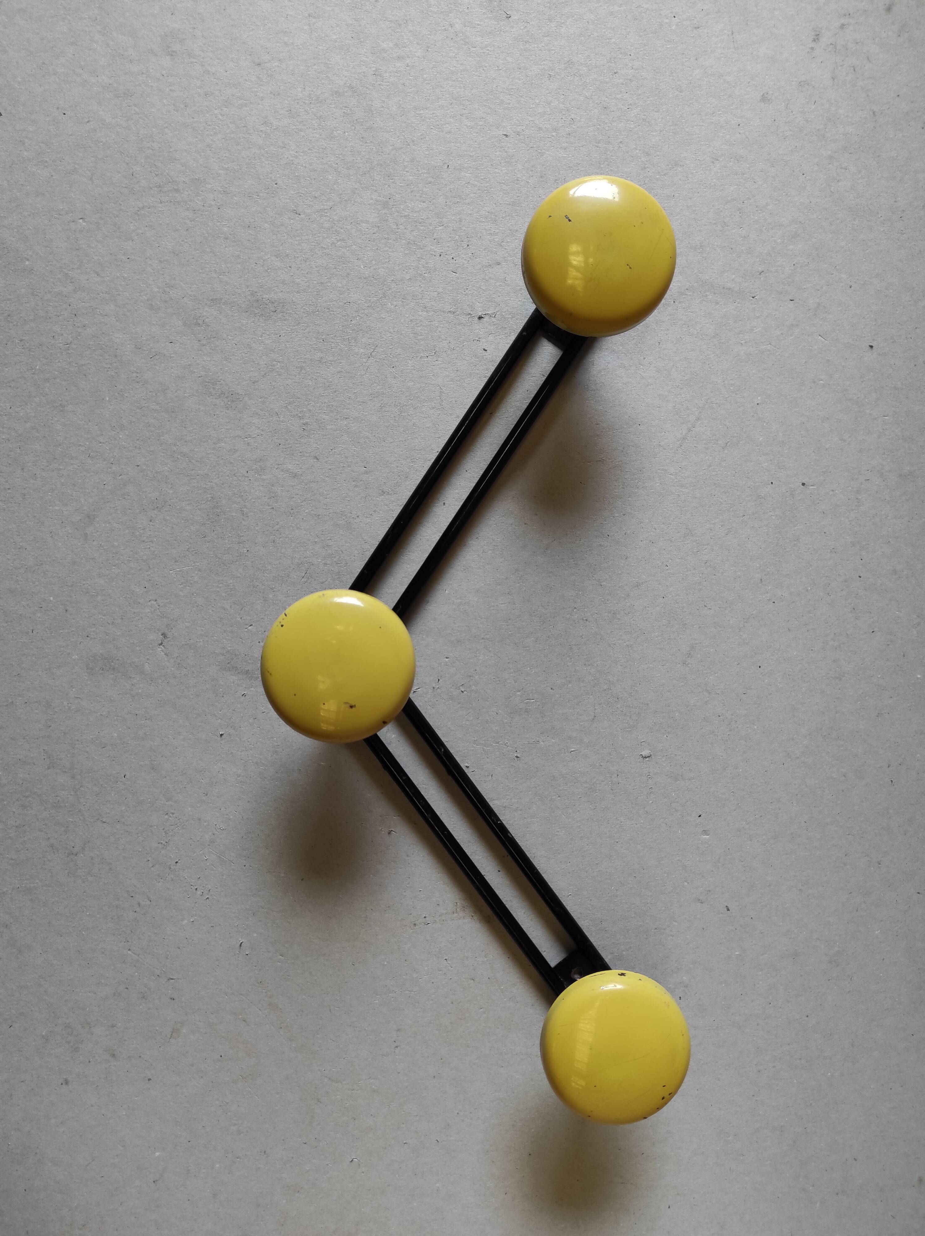 Vintage wall mount in black and yellow metal