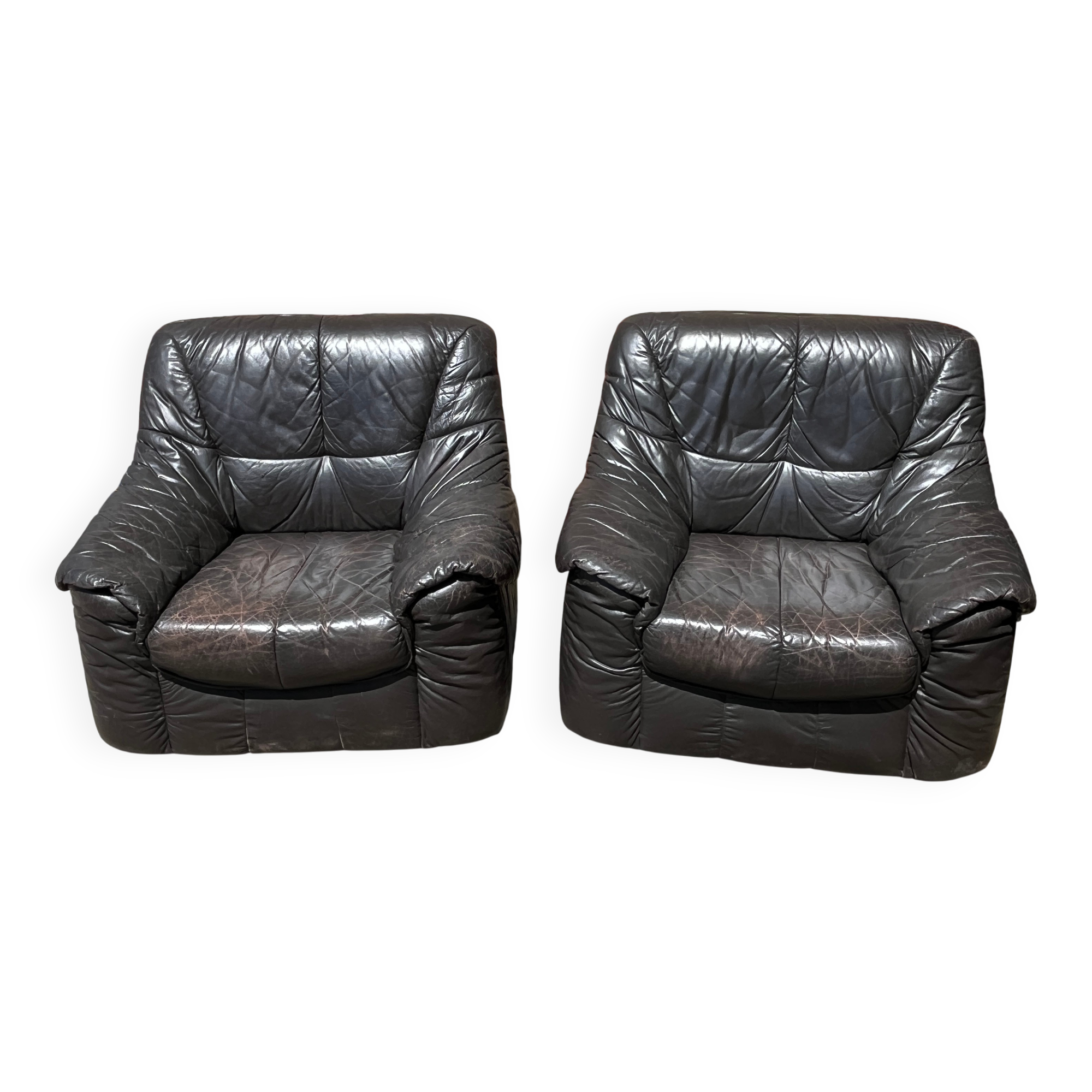 Pair of patinated leather club armchairs