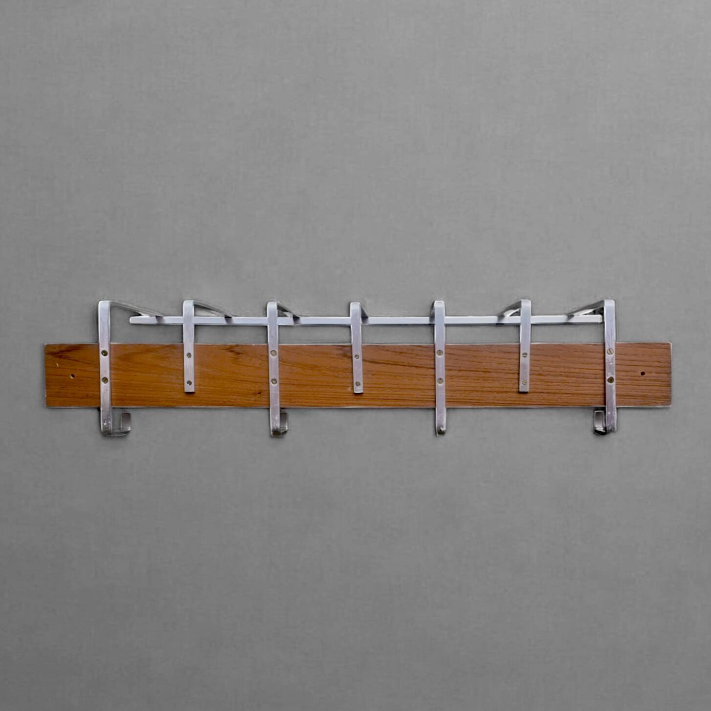 Vintage wall-mounted coat rack made of plywood and aluminum with hat rack