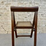 Wooden folding chair with caned seat