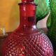 Red glass vitae bottle