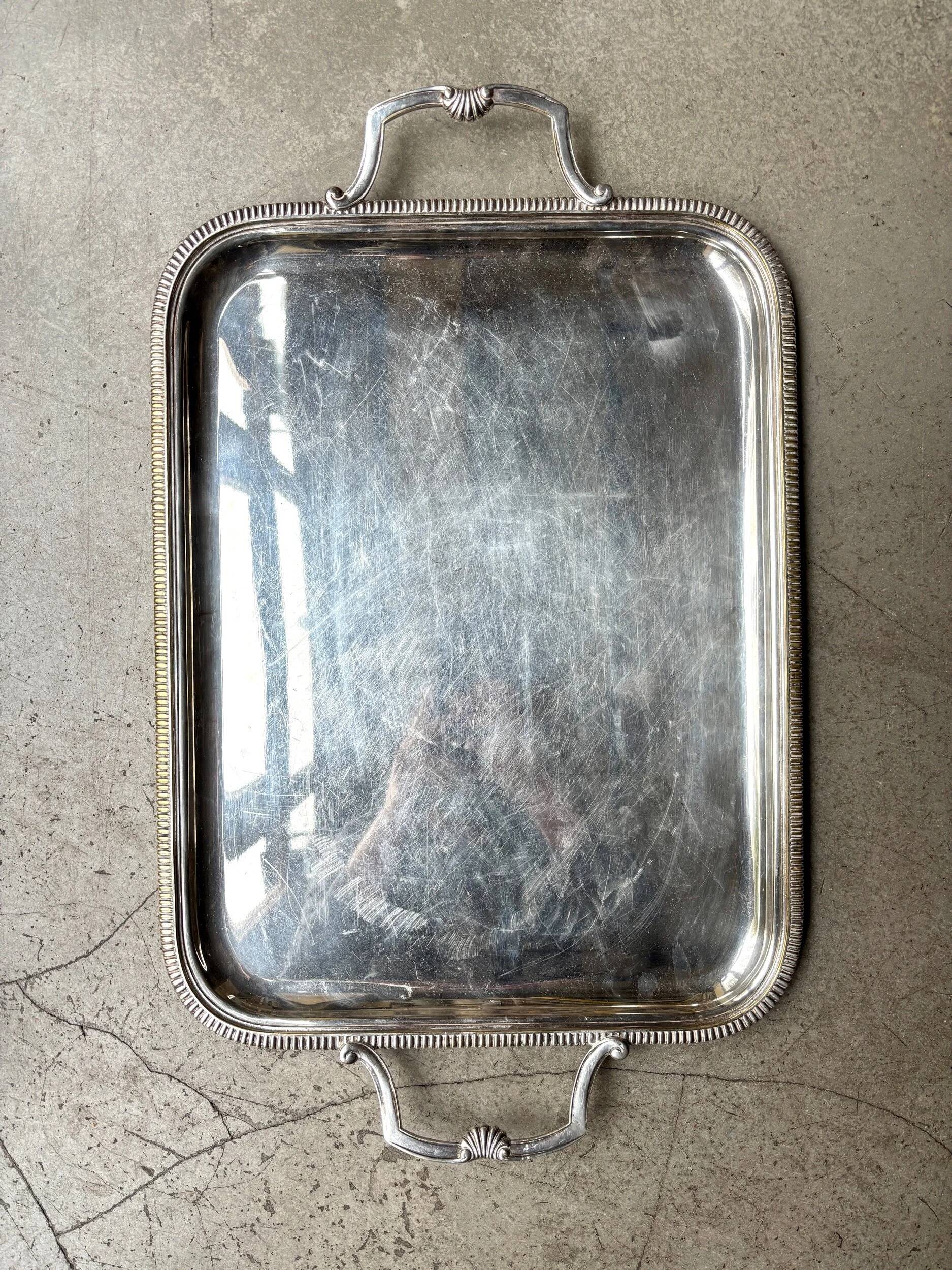 Rectangular silver-plated metal tray with a striated and shell design