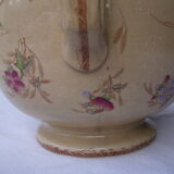 Antique pitcher decorated with flowers