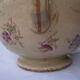 Antique pitcher decorated with flowers