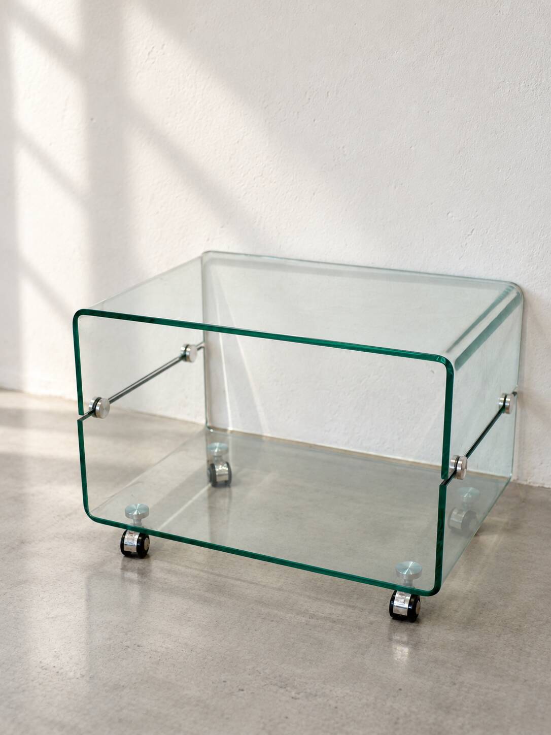 Glass coffee table on wheels