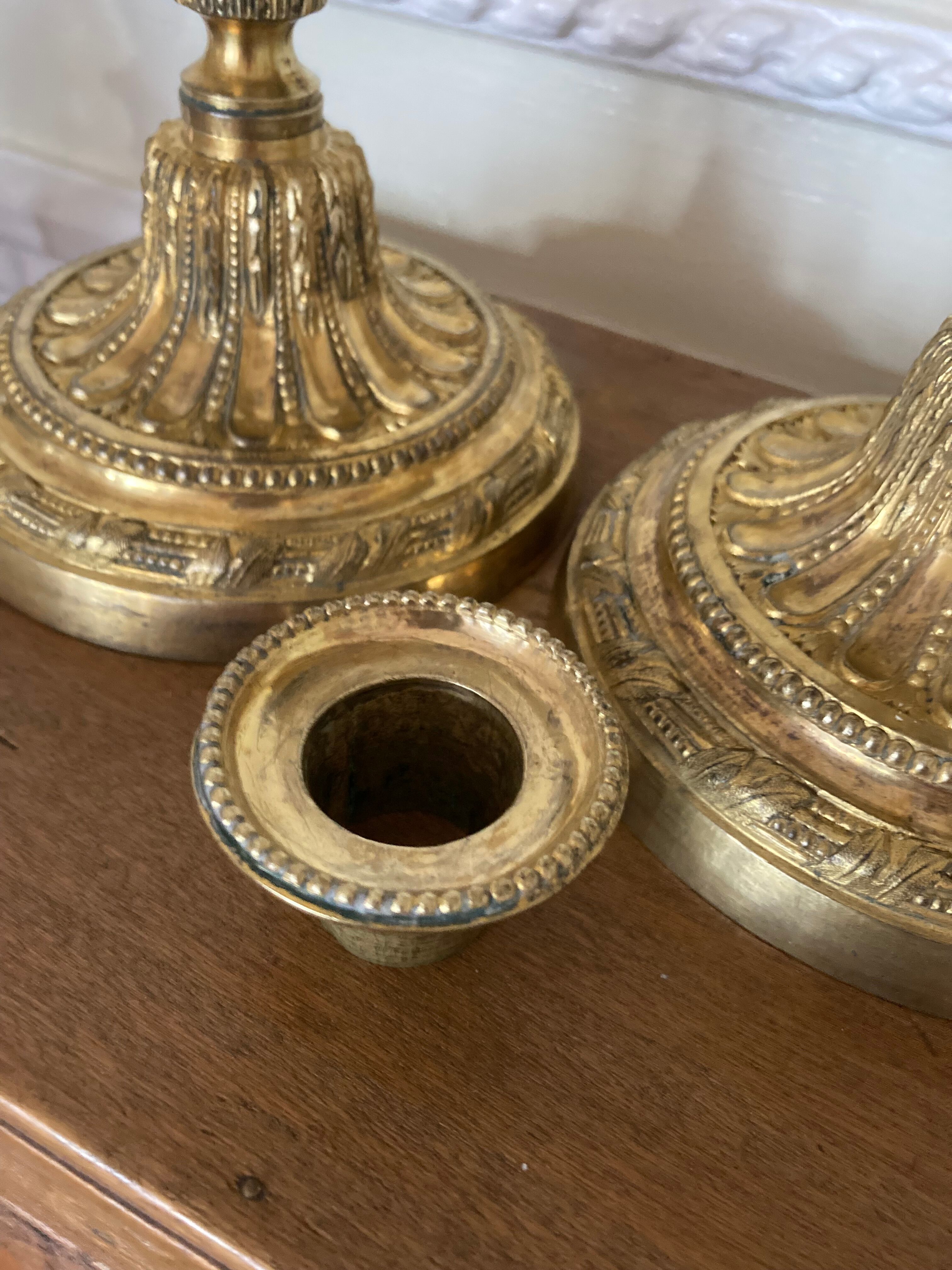 Pair of Louis XVI torch candlesticks in gilded bronze