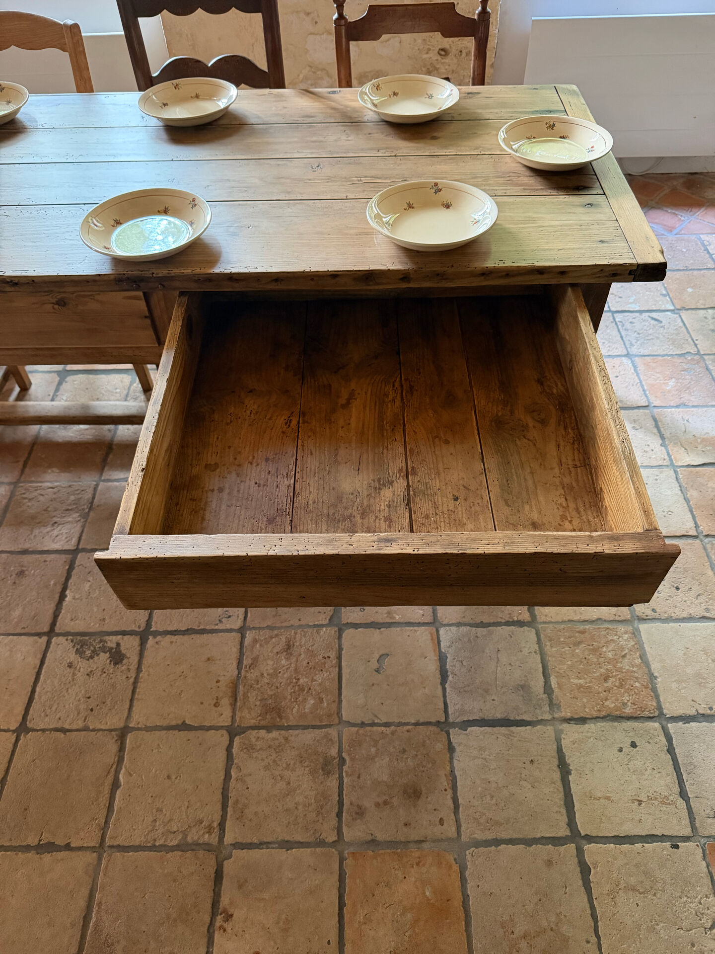 Renovated raw wood farmhouse table
