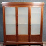 Large pine bookcase with three doors, fitted with frosted glass.