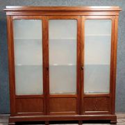 Large pine bookcase with three doors, fitted with frosted glass.