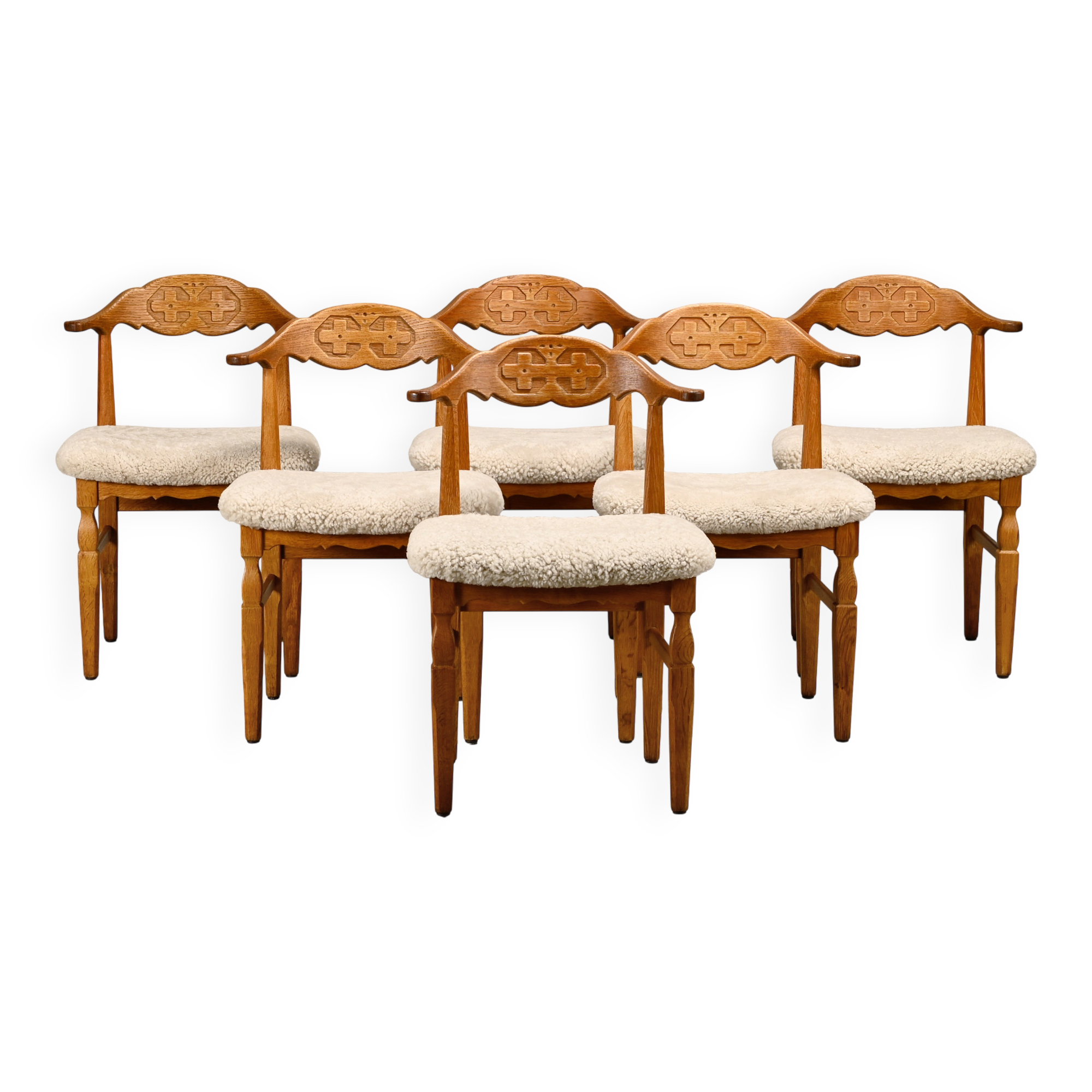Henning Kjærnulf brutalist dining chairs set in Oak and Sheepskin, Denmark