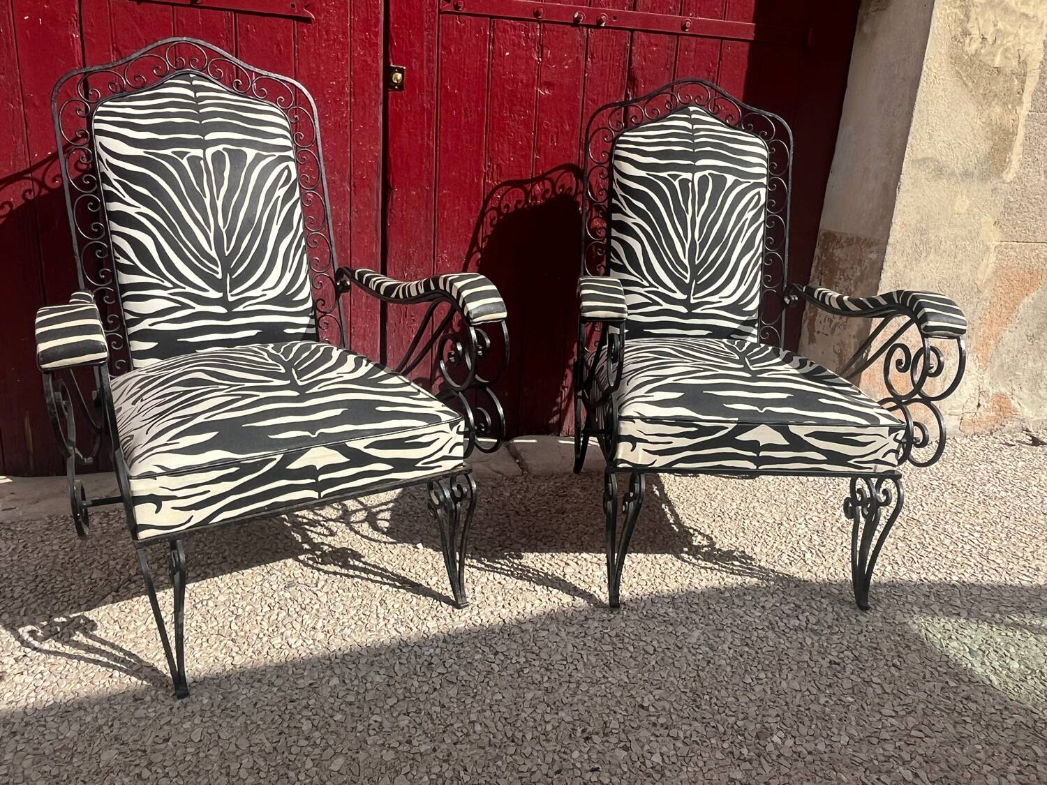 Pair of wrought iron armchairs