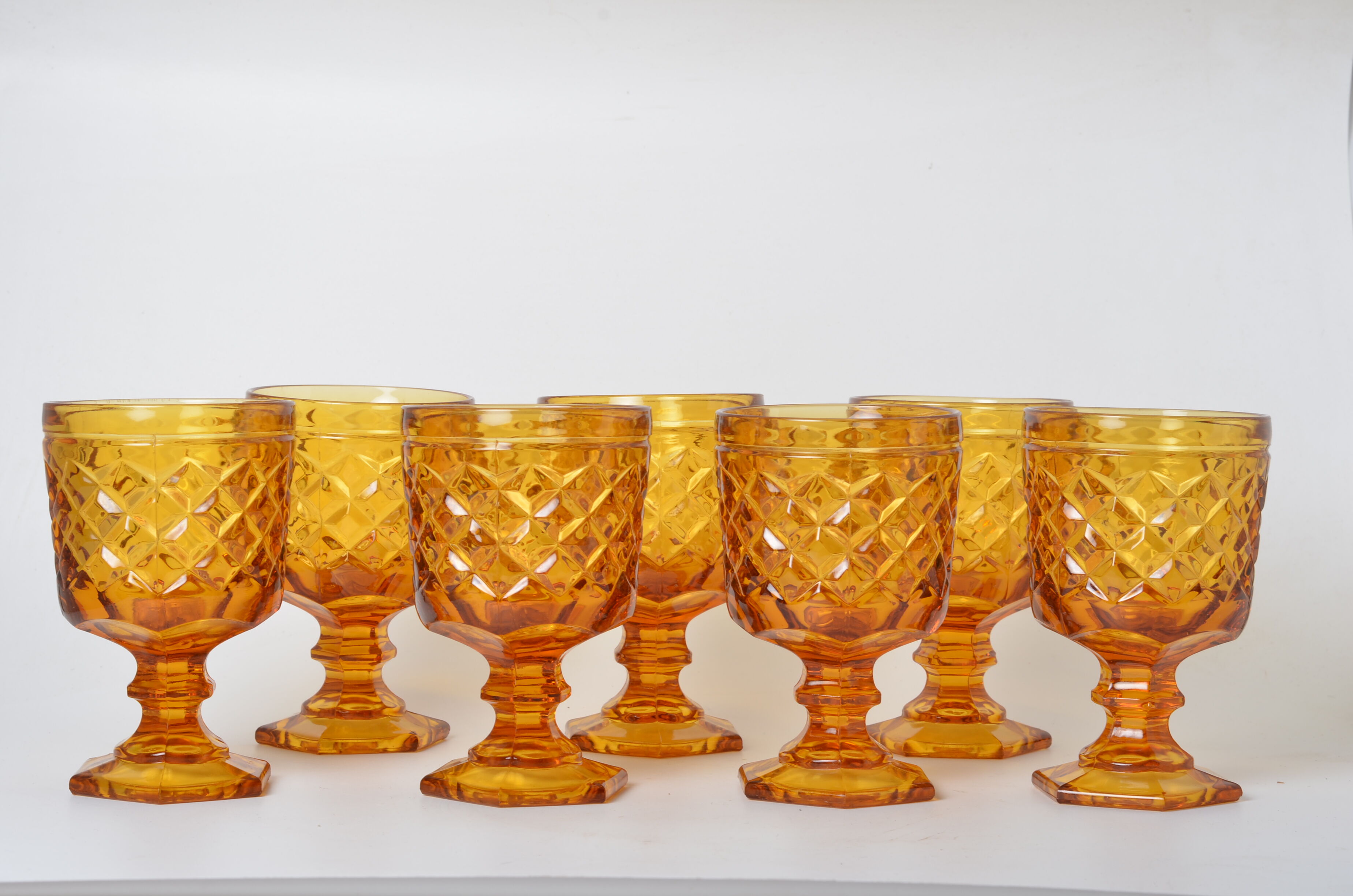 7 amber stemmed glasses