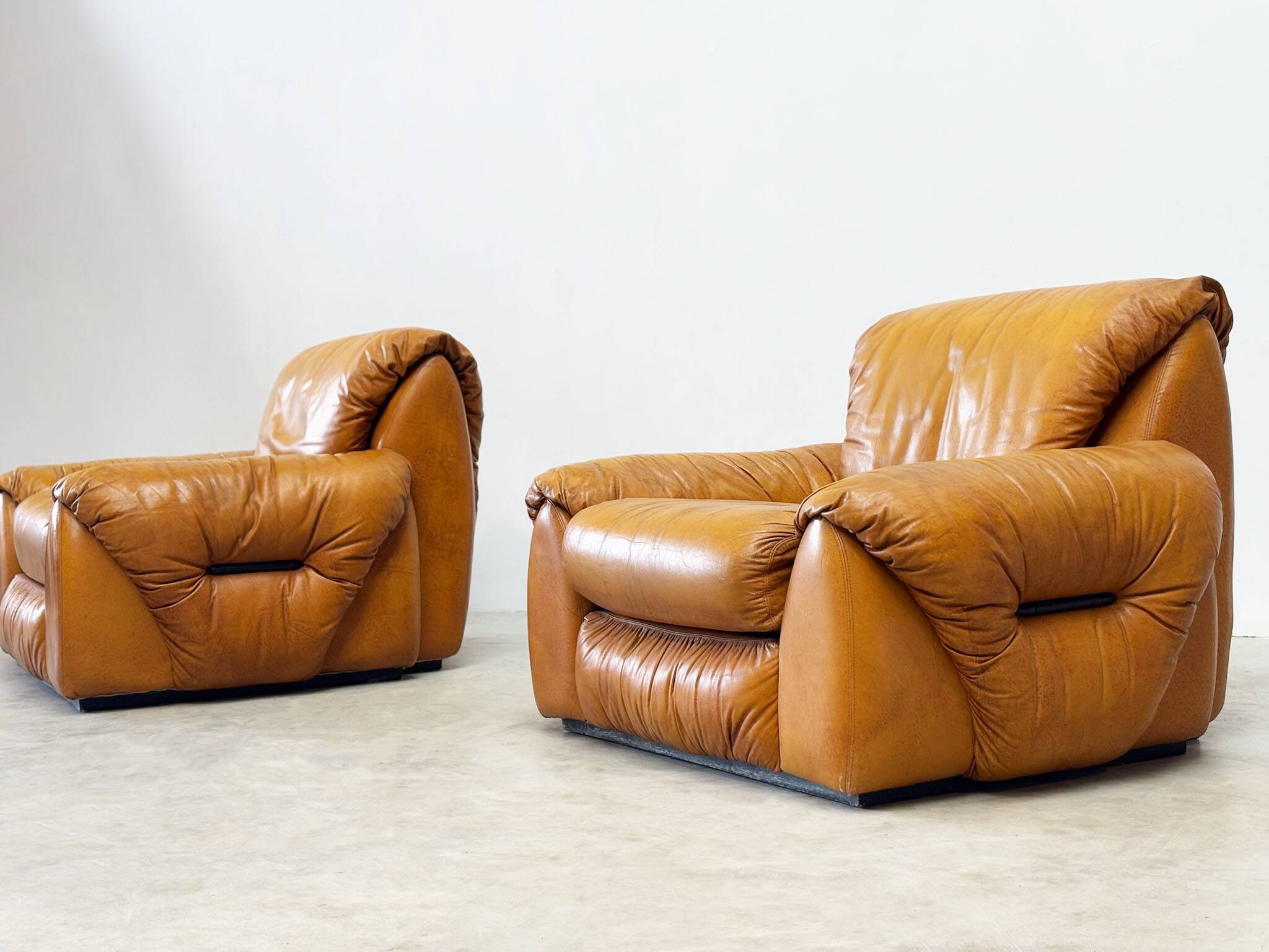 Set of two Italian cognac leather lounge chairs