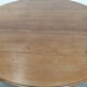 Antique English drop-leaf dining table made of walnut with elegant legs