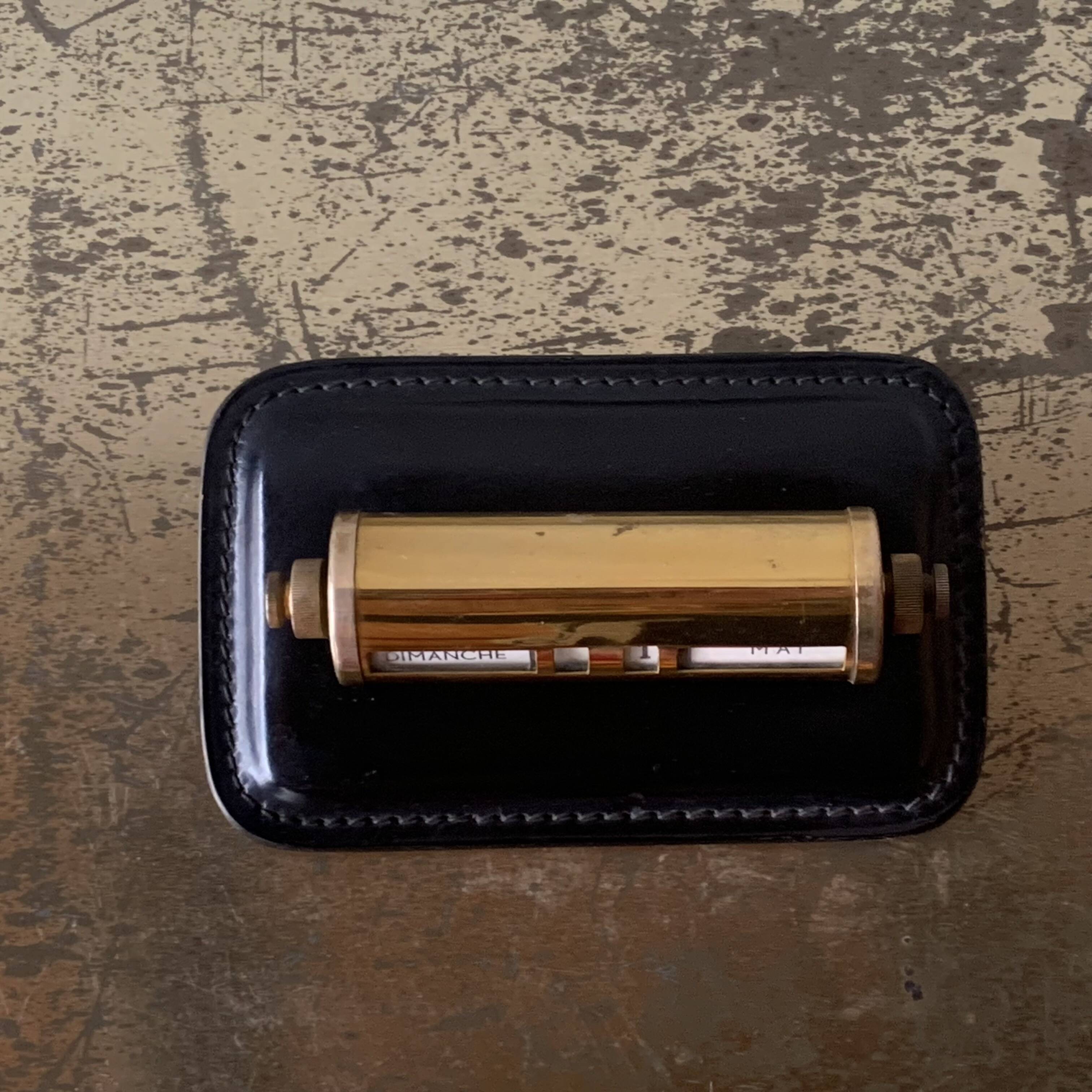 Old perpetual calendar in leather and brass