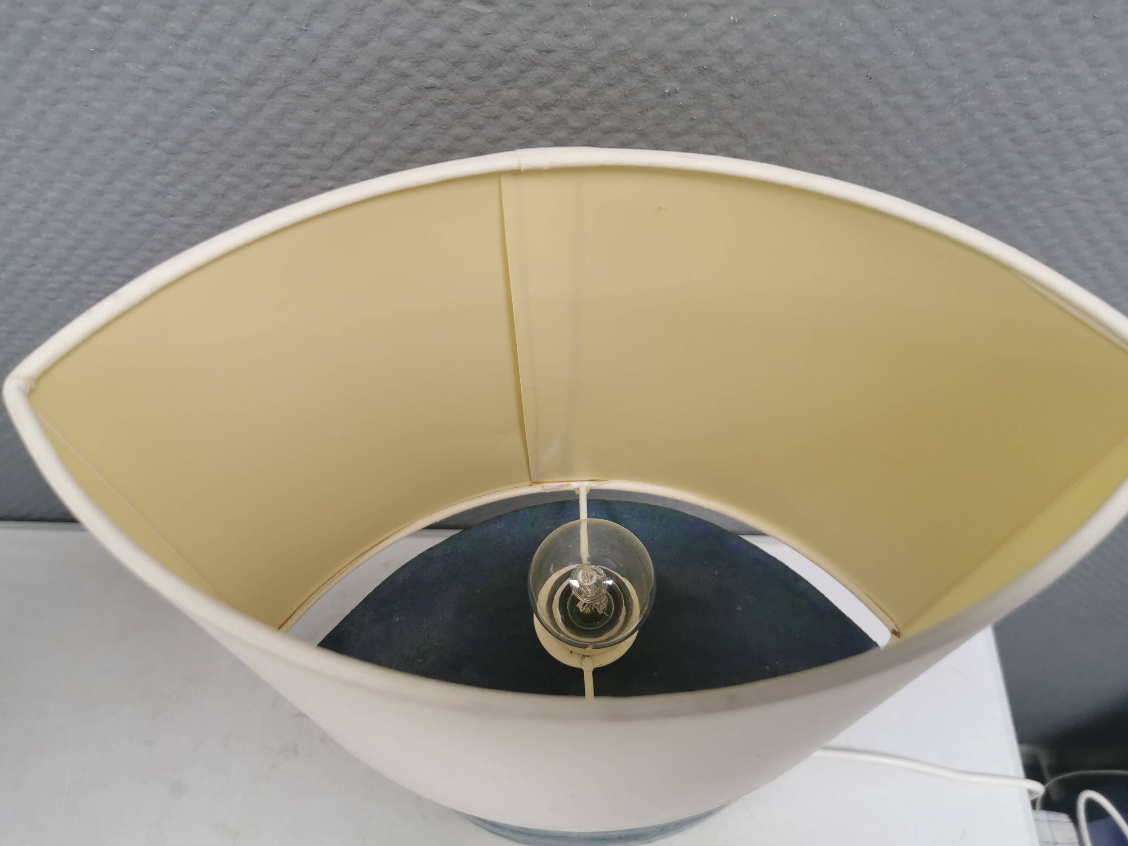 Sculptural table lamp in blue glaze with an abstract expression.