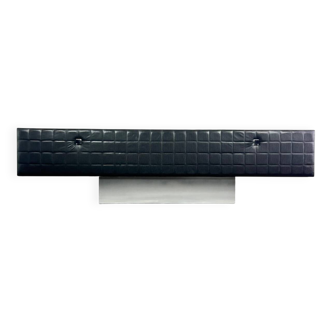 Modernist lowboard, faux leather, wood and stainless steel, 1960.