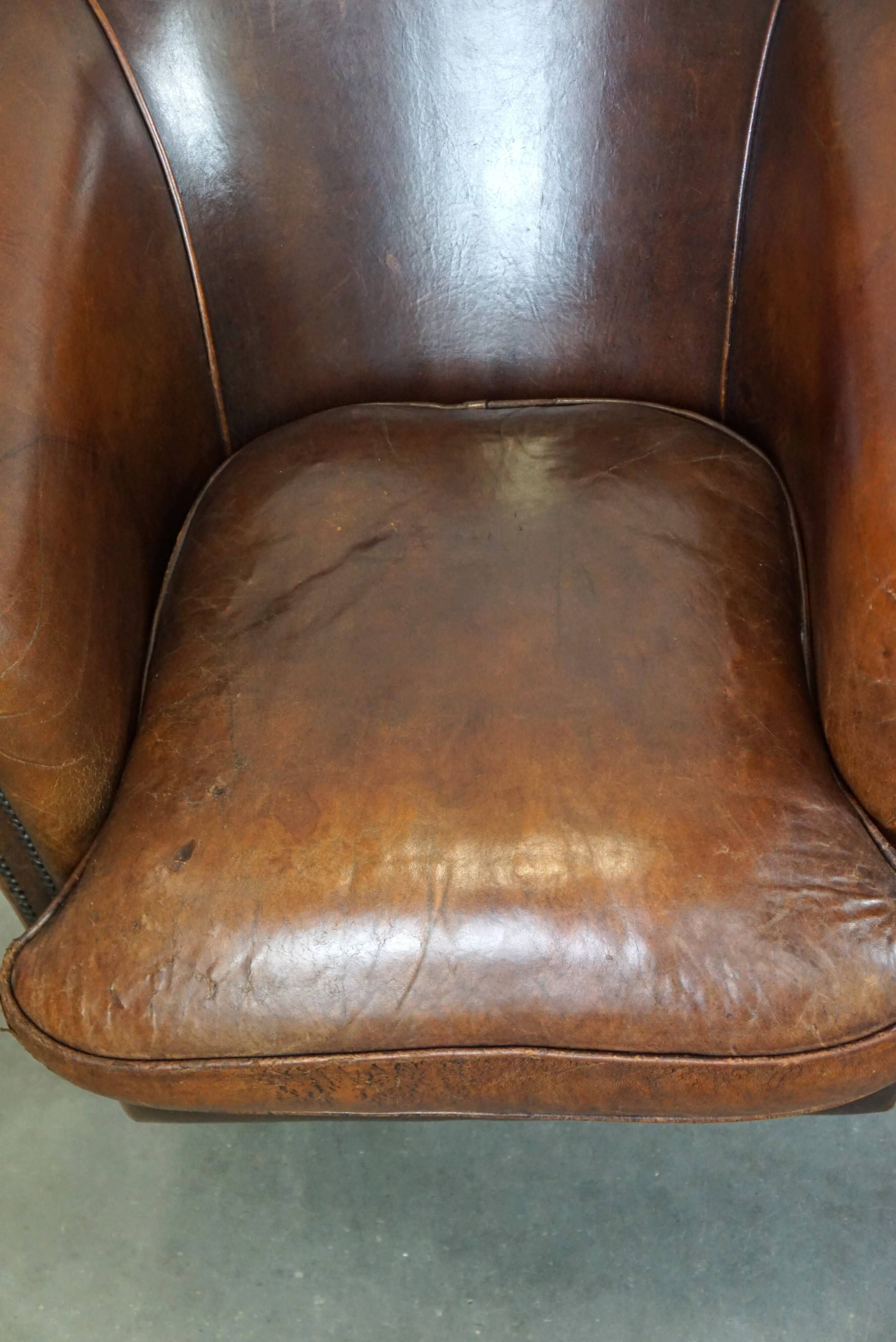 Set of two rugged sheep let of two rugged sheep leather club armchairs with a nice distressed look