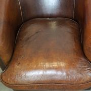 Set of two rugged sheep let of two rugged sheep leather club armchairs with a nice distressed look
