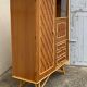 Rattan wardrobe with tapered legs from the 1960s.