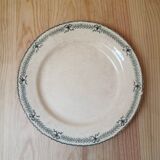 Large old round plate in iron earth