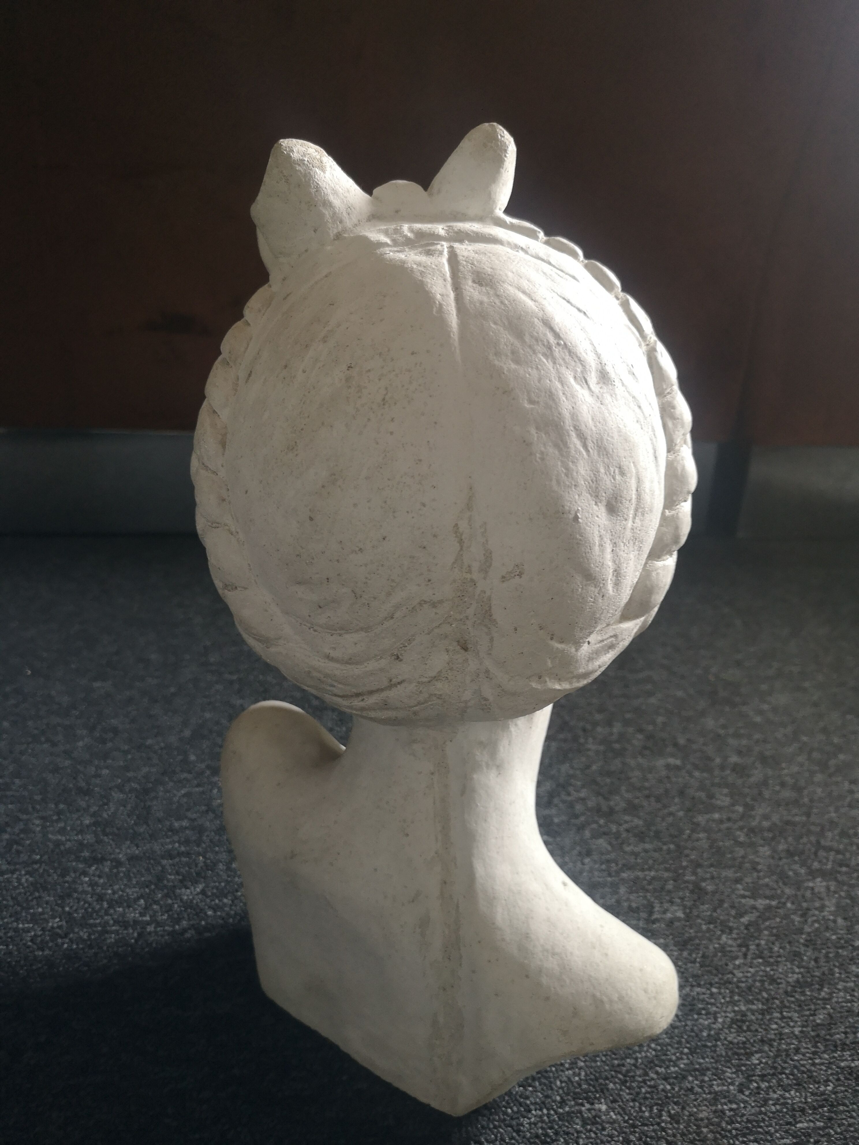 Bust girl in patinated terracotta