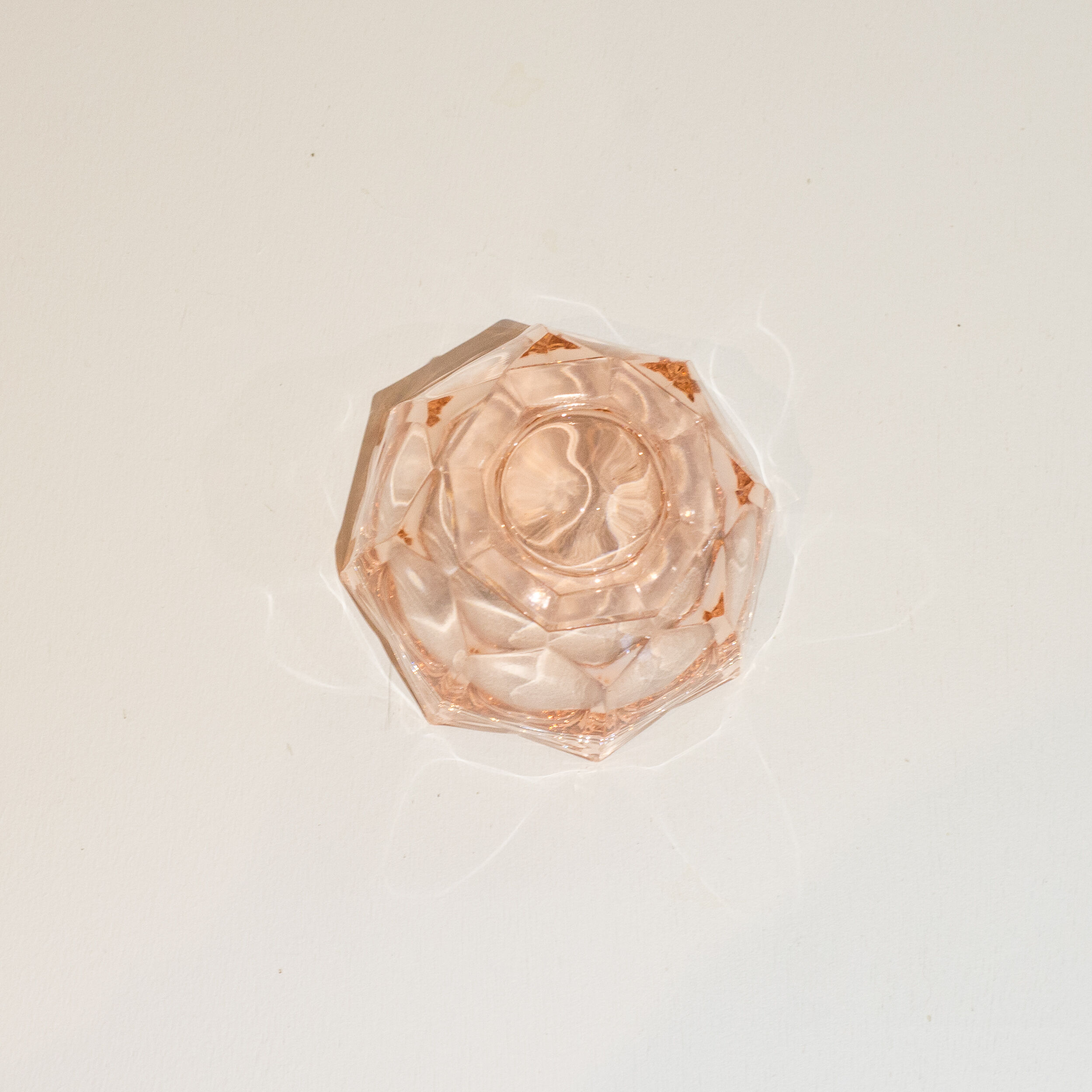 Empty pink glass jar pocket