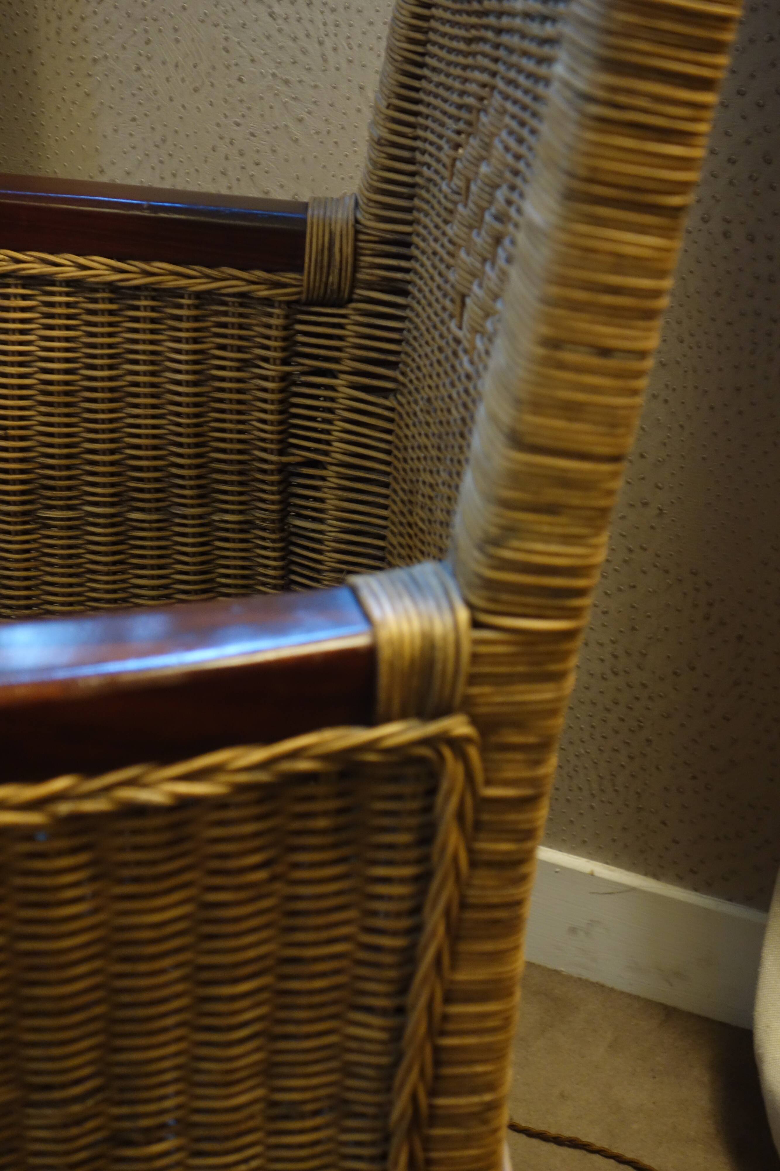 comfortable colonial-style armchair in rattan and mahogany