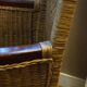 comfortable colonial-style armchair in rattan and mahogany