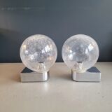 Pair of vintage wall lights in chrome metal with bubbled glass globes.