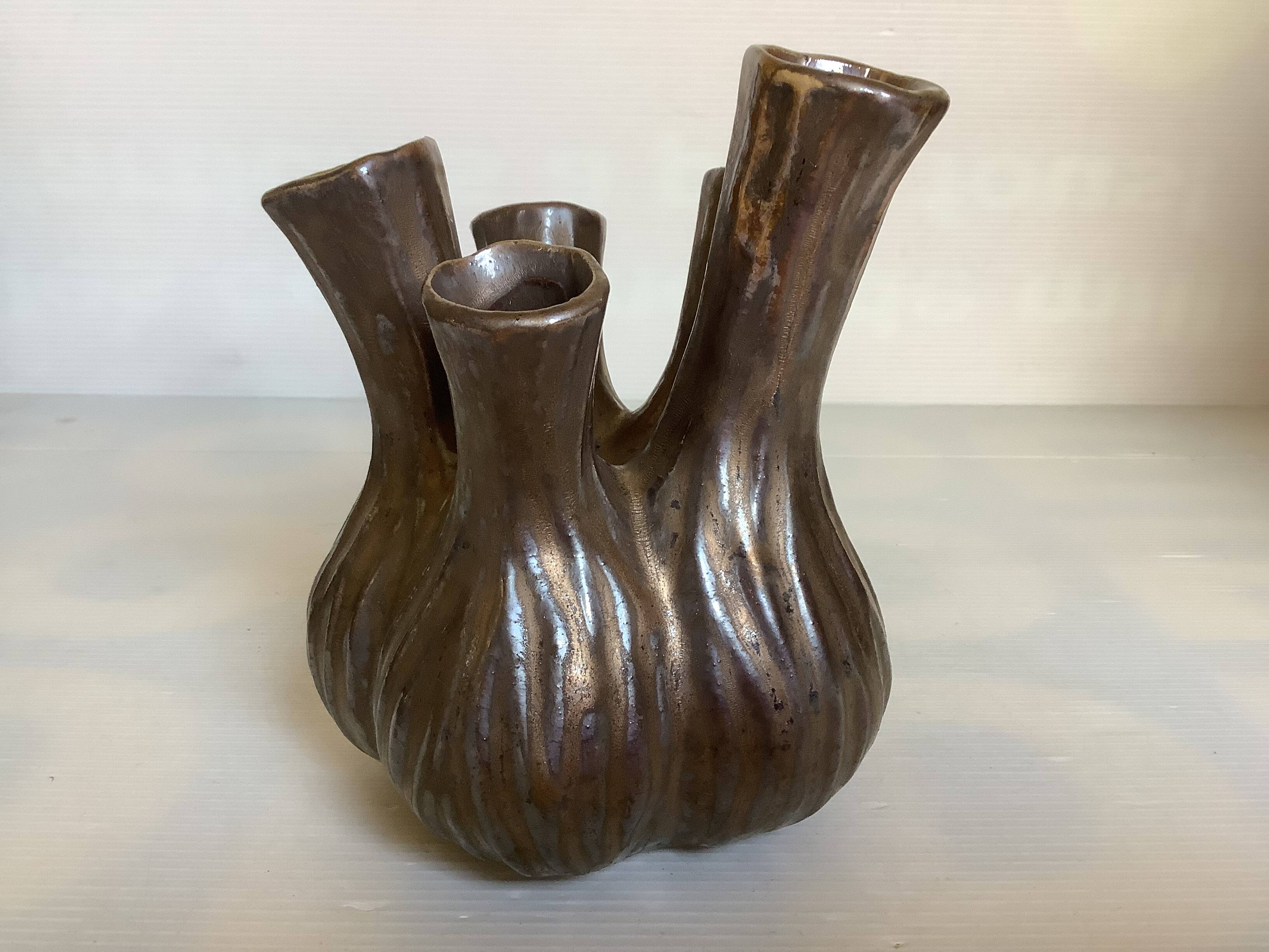 Tulip vase with ceramic flowers in brown and gold.