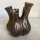 Tulip vase with ceramic flowers in brown and gold.