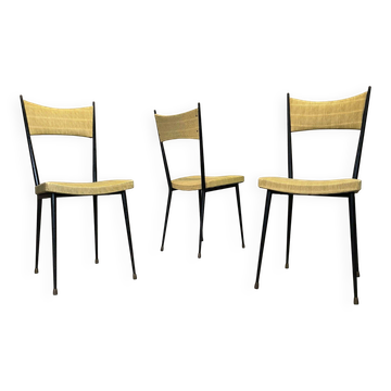 Three vintage chairs in the style of Colette Gueden.